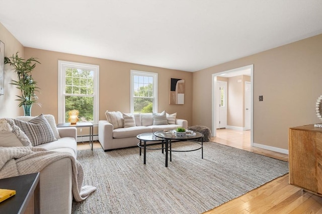 6 Magnolia Cir, Norfolk, MA 02056 - living room featuring a baseboard heating unit and light wood finished floors