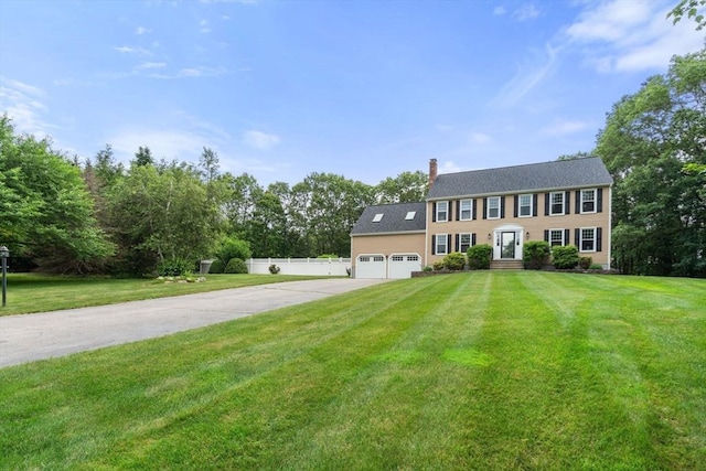 6 Magnolia Cir, Norfolk, MA 02056 - colonial-style house with driveway, an attached garage, and a chimney