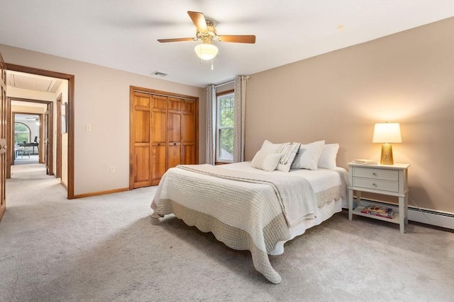 6 Magnolia Cir, Norfolk, MA 02056 - bedroom with light carpet, attic access, a closet, a baseboard radiator, and a ceiling fan