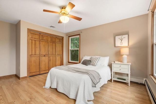 6 Magnolia Cir, Norfolk, MA 02056 - bedroom featuring a baseboard radiator, a closet, light wood-type flooring, and ceiling fan
