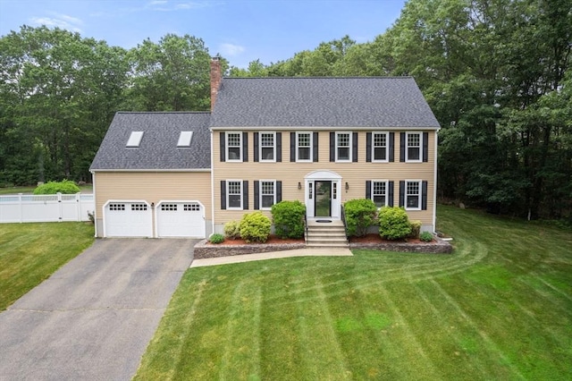 6 Magnolia Cir, Norfolk, MA 02056 - colonial house with driveway, an attached garage, a chimney, and a shingled roof