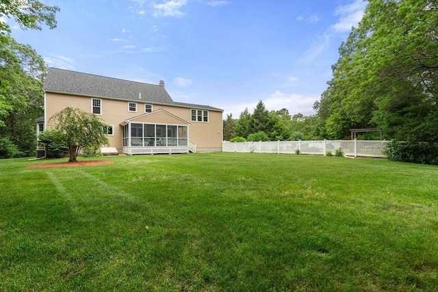 6 Magnolia Cir, Norfolk, MA 02056 - back of property featuring a sunroom and a chimney