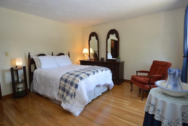 bedroom with wood-type flooring