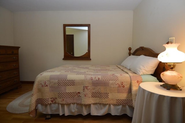 bedroom with wood-type flooring