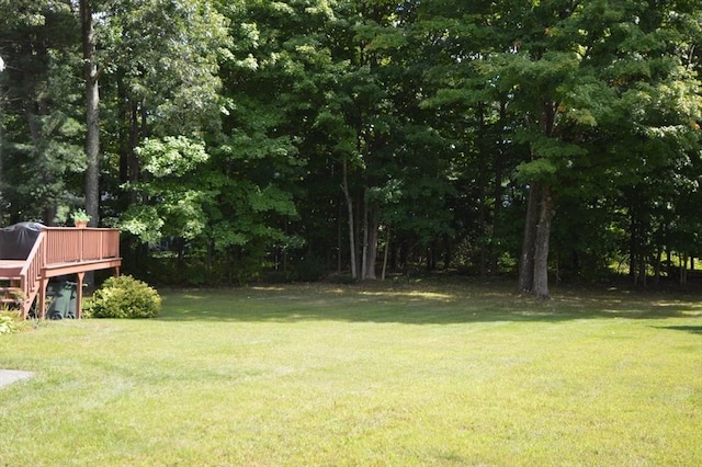 view of yard with a deck