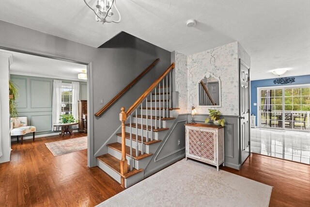 42 Britton St, Raynham, MA 02767 - staircase featuring wood finished floors and a decorative wall