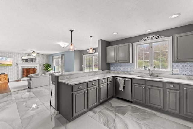 42 Britton St, Raynham, MA 02767 - kitchen with dishwasher, a sink, gray cabinetry, a peninsula, and light marble finish floors