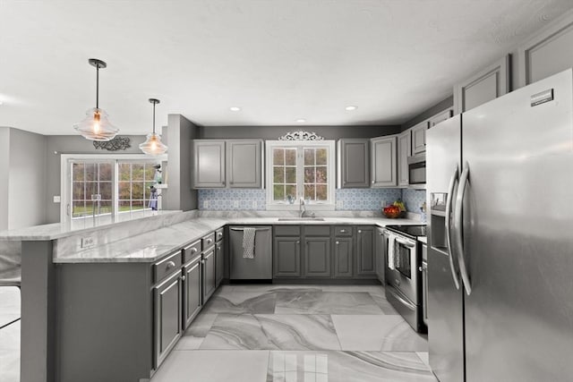 42 Britton St, Raynham, MA 02767 - kitchen with appliances with stainless steel finishes, gray cabinetry, plenty of natural light, and recessed lighting