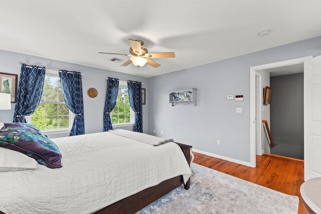42 Britton St, Raynham, MA 02767 - bedroom with wood finished floors, baseboards, and a ceiling fan