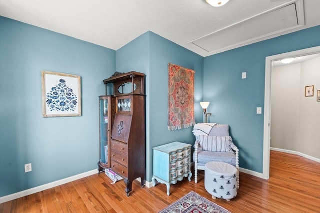 42 Britton St, Raynham, MA 02767 - living area with attic access, wood finished floors, and baseboards