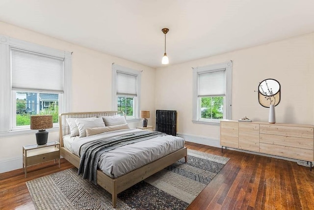 bedroom featuring dark wood-type flooring and baseboards