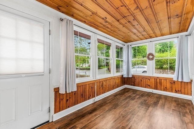 unfurnished sunroom featuring plenty of natural light and french doors