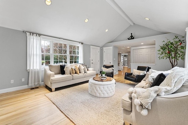 living room featuring visible vents, beamed ceiling, baseboards, recessed lighting, and light wood finished floors