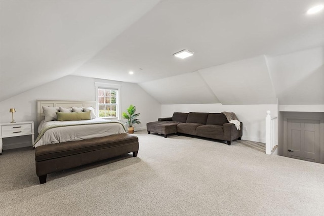 carpeted bedroom with vaulted ceiling