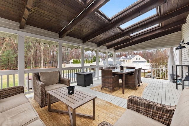 wooden deck with outdoor dining space and outdoor lounge area