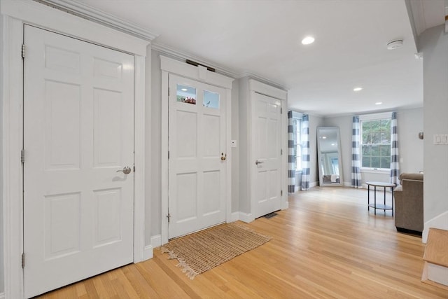 foyer featuring recessed lighting, baseboards, and light wood-type flooring