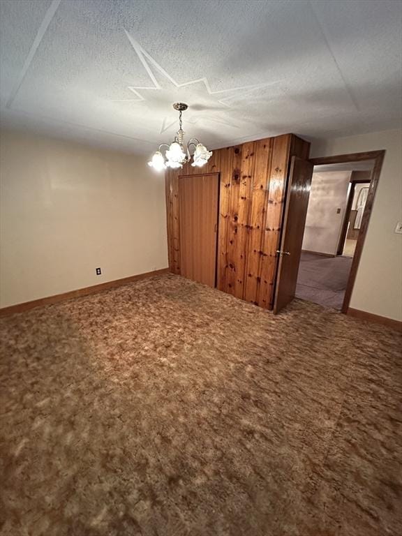 50 Keene St, Lowell, MA 01852 - carpeted empty room featuring a chandelier and a textured ceiling