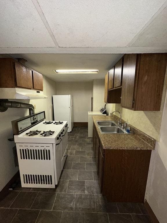 50 Keene St, Lowell, MA 01852 - kitchen with white appliances, under cabinet range hood, and dark brown cabinets