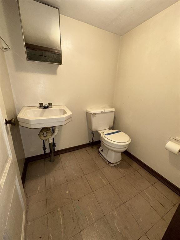 50 Keene St, Lowell, MA 01852 - bathroom with toilet and baseboards