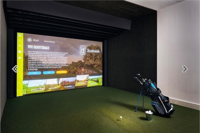 recreation room featuring carpet floors, beamed ceiling, and golf simulator