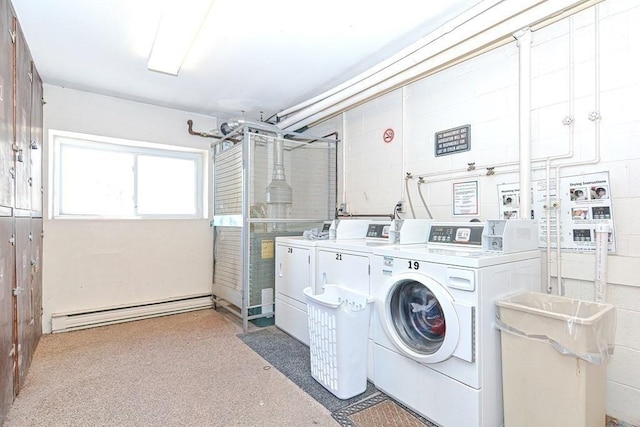 laundry area with washer and dryer and baseboard heating