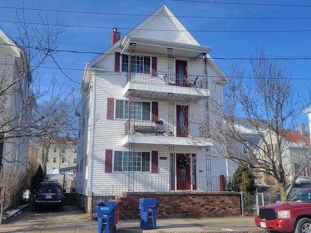 front of property featuring a balcony