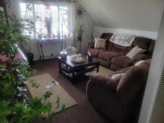 carpeted living room featuring lofted ceiling