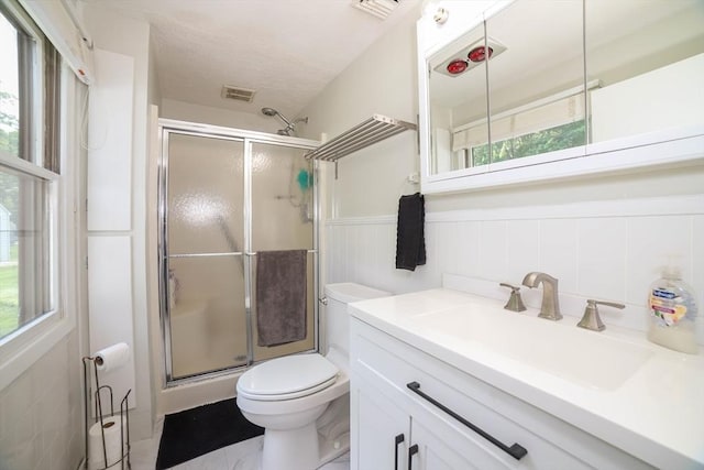 40 Old Stage Rd, Chelmsford, MA 01824 - bathroom featuring toilet, a shower stall, vanity, and a wainscoted wall