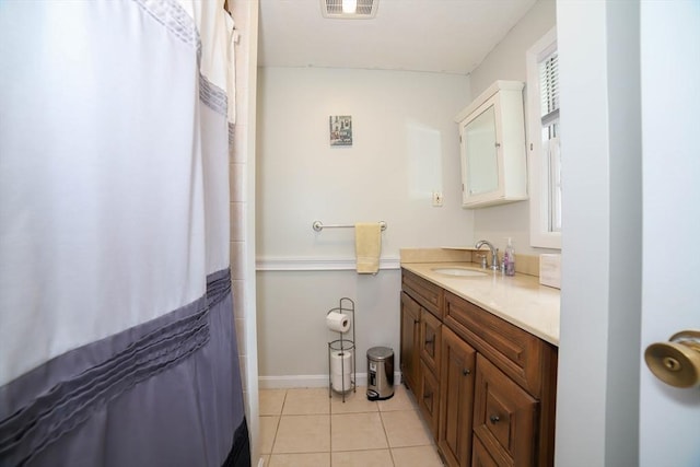 40 Old Stage Rd, Chelmsford, MA 01824 - full bath with vanity, tile patterned floors, baseboards, and a shower with shower curtain