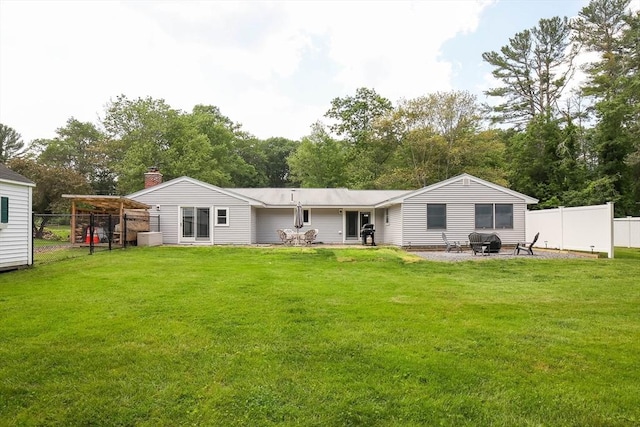 40 Old Stage Rd, Chelmsford, MA 01824 - back of property featuring a patio, a chimney, and view of wooded area
