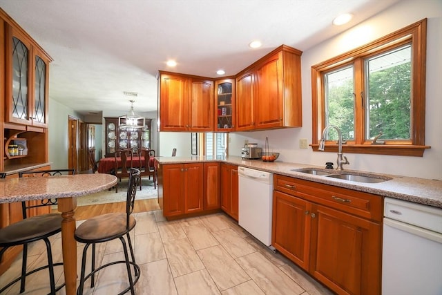 40 Old Stage Rd, Chelmsford, MA 01824 - kitchen featuring dishwasher, a sink, brown cabinets, glass insert cabinets, and recessed lighting