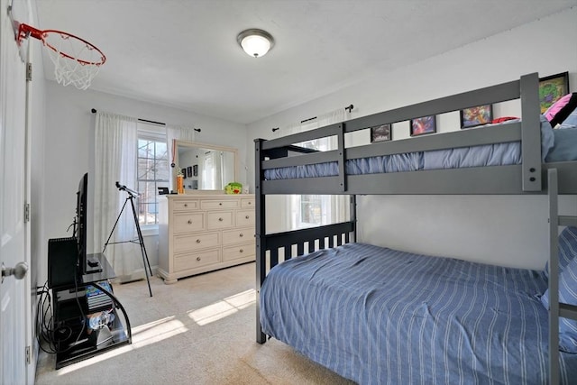 bedroom featuring light carpet