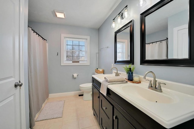 bathroom with toilet, tile patterned flooring, baseboards, and vanity