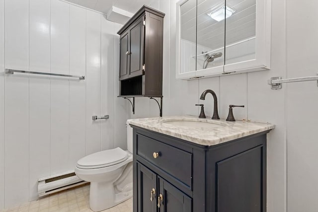 bathroom featuring a baseboard radiator, vanity, and toilet