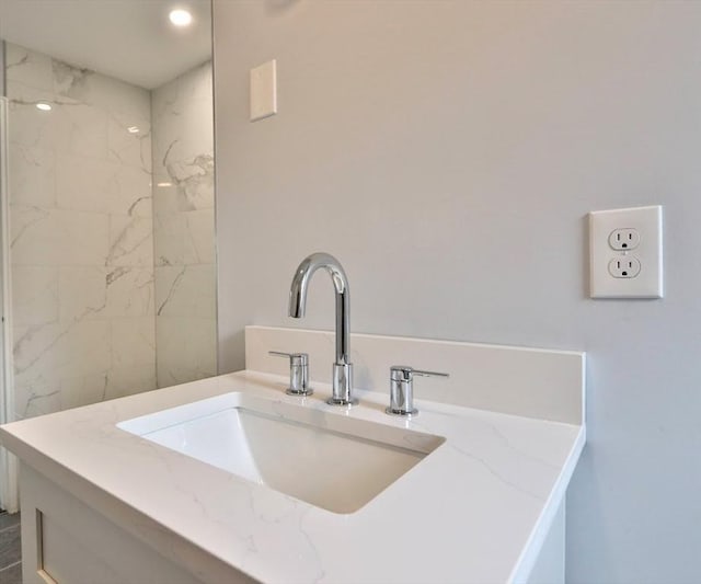 bathroom view of vanity and recessed lighting