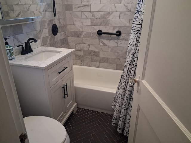 513 Washington Ave, Chelsea, MA 02150 - bathroom featuring toilet, vanity, tile walls, and shower / tub combo