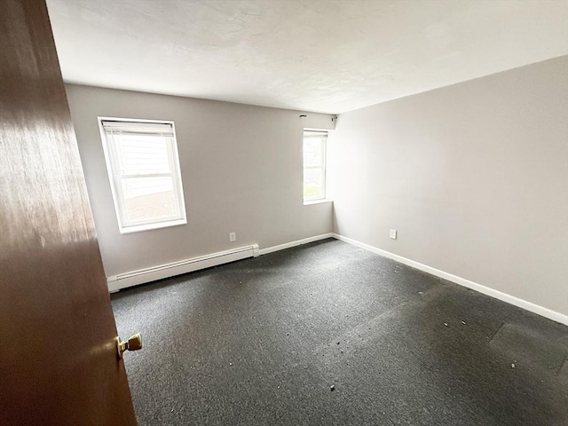 5-7 Monk St, Stoughton, MA 02072 - spare room featuring a baseboard heating unit and baseboards