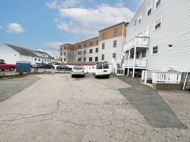 5-7 Monk St, Stoughton, MA 02072 - uncovered parking lot featuring a residential view