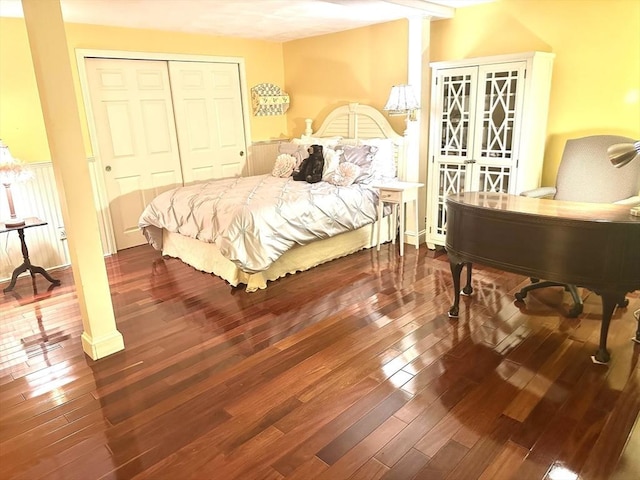 bedroom featuring hardwood / wood-style flooring and a closet