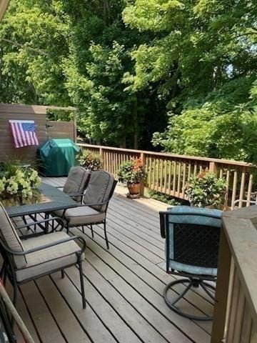 wooden terrace with area for grilling