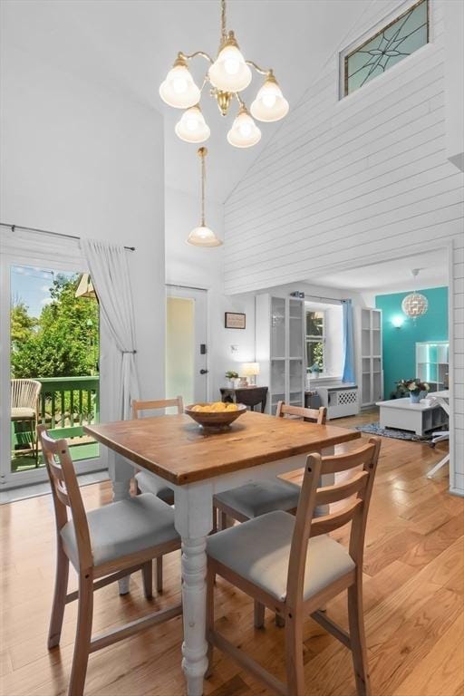 29 1st St Unit C, Salem, MA 01970 - dining area featuring high vaulted ceiling, a chandelier, and light wood-style flooring