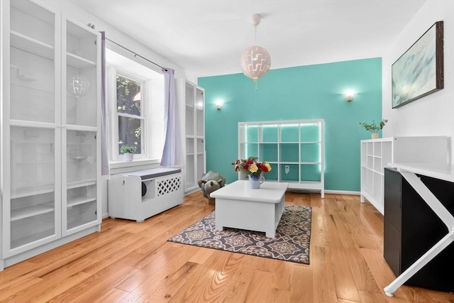 29 1st St Unit C, Salem, MA 01970 - office area featuring radiator heating unit and light wood-style floors