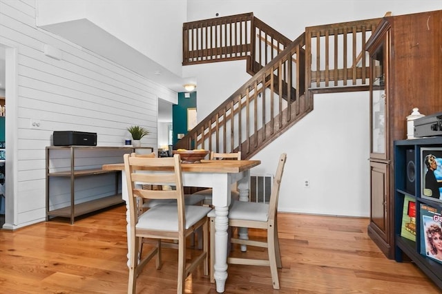 29 1st St Unit C, Salem, MA 01970 - dining area with wood finished floors, stairs, wooden walls, and a high ceiling