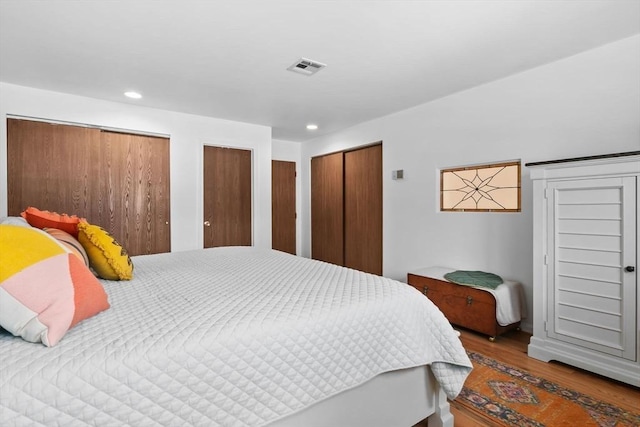 29 1st St Unit C, Salem, MA 01970 - bedroom with wood finished floors, two closets, and recessed lighting