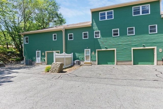29 1st St Unit C, Salem, MA 01970 - rear view of property featuring driveway and a garage