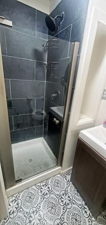 10 Monroe, Springfield, MA 01109 - full bath featuring a stall shower, vanity, and tile patterned floors