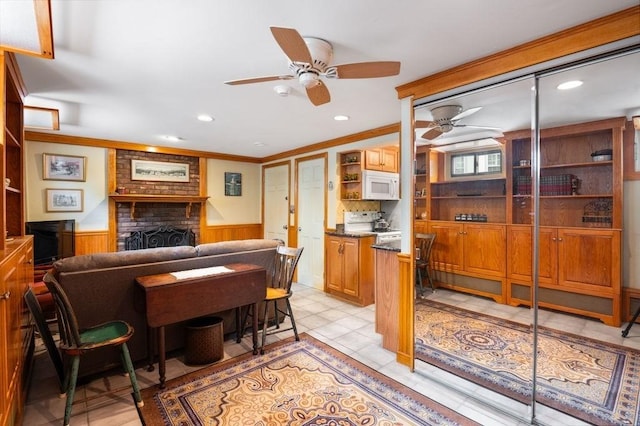 8 Franklin St Unit 18, Marblehead, MA 01945 - living area featuring a ceiling fan, wainscoting, ornamental molding, a fireplace, and recessed lighting