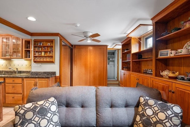 8 Franklin St Unit 18, Marblehead, MA 01945 - kitchen featuring open shelves, a sink, ceiling fan, brown cabinetry, and glass insert cabinets