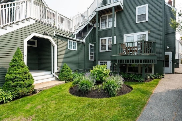 8 Franklin St Unit 18, Marblehead, MA 01945 - rear view of property with a balcony and a yard