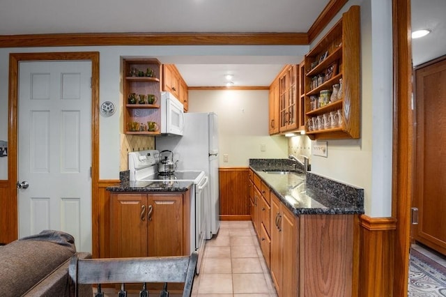 8 Franklin St Unit 18, Marblehead, MA 01945 - kitchen with open shelves, white microwave, wainscoting, a sink, and electric stove